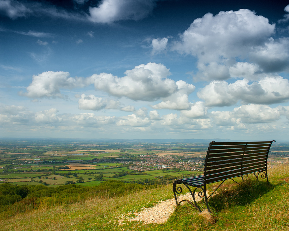 a bench at the top of cleeve hill in cheltenham gloucestershire