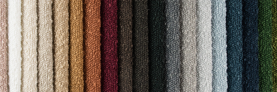 an array of boucle fabrics in different colours